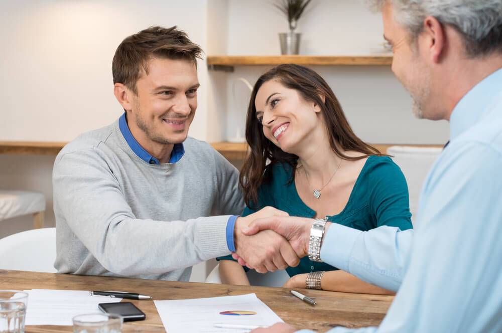 Couple speaking with a lawyer