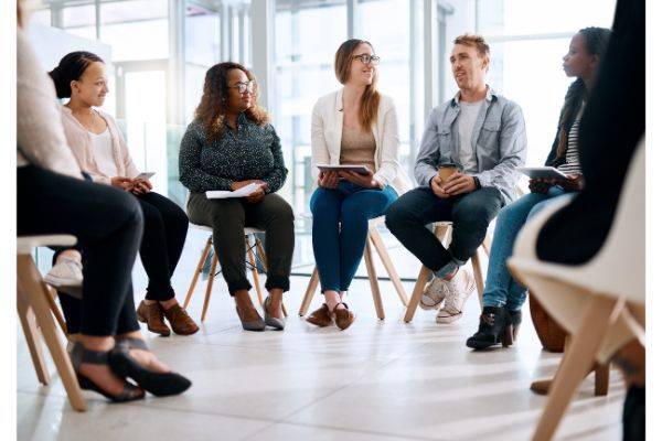 Support group sitting in a circle. 7 people showed in the circle.