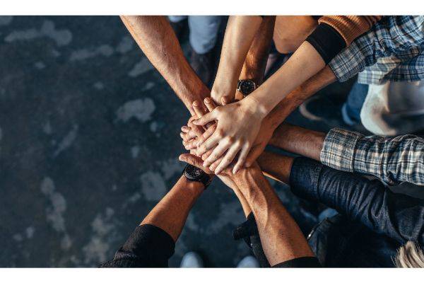 Hands of people together in solidarity