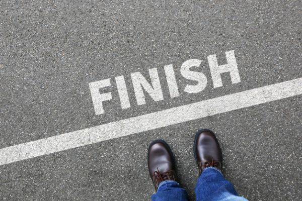 man standing at finish line