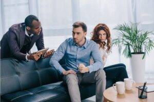 Man and women in an office with a mediator