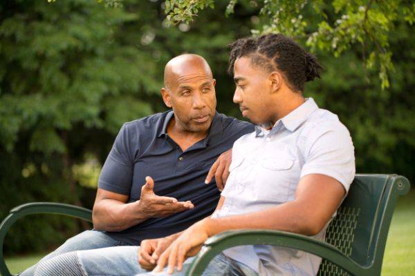 Father speaking with grown son