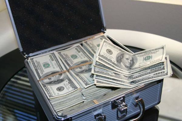 Piles of money inside of a briefcase