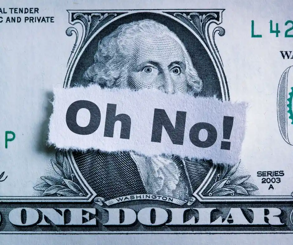 a dollar with a torn paper in the middle with bold letters "Oh, No!"