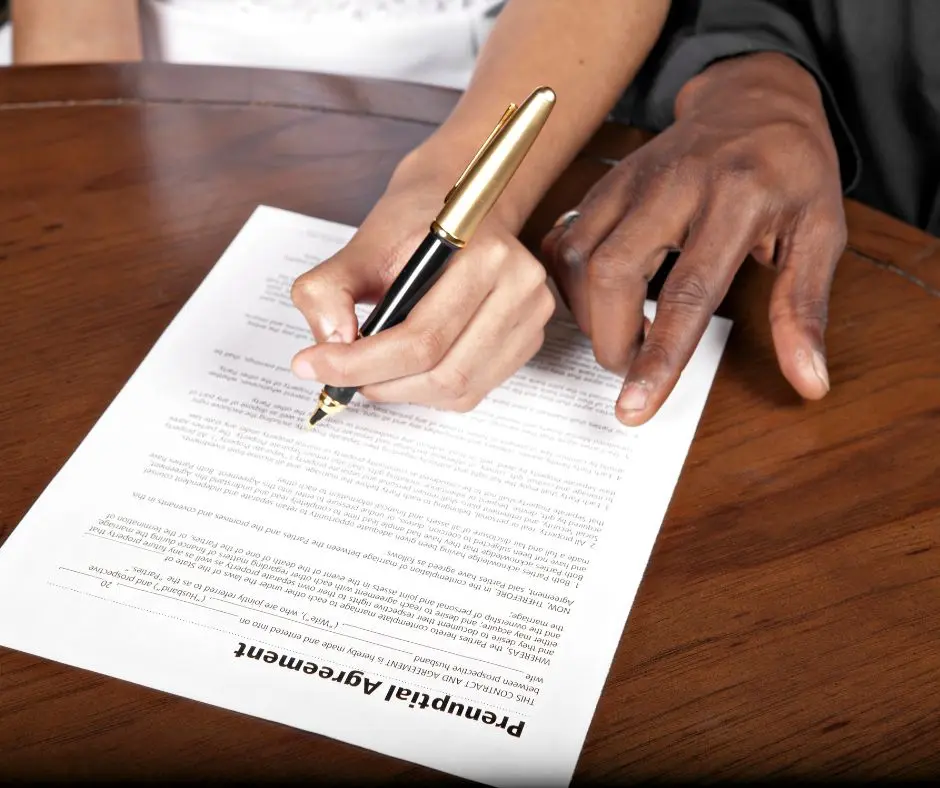 Do I Need a Prenuptial Agreement: a couple is signing a prenuptial agreement