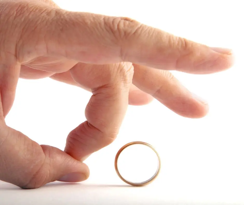 5 signs you might be ready for a divorce: a wedding ring is being finger-picked away. 