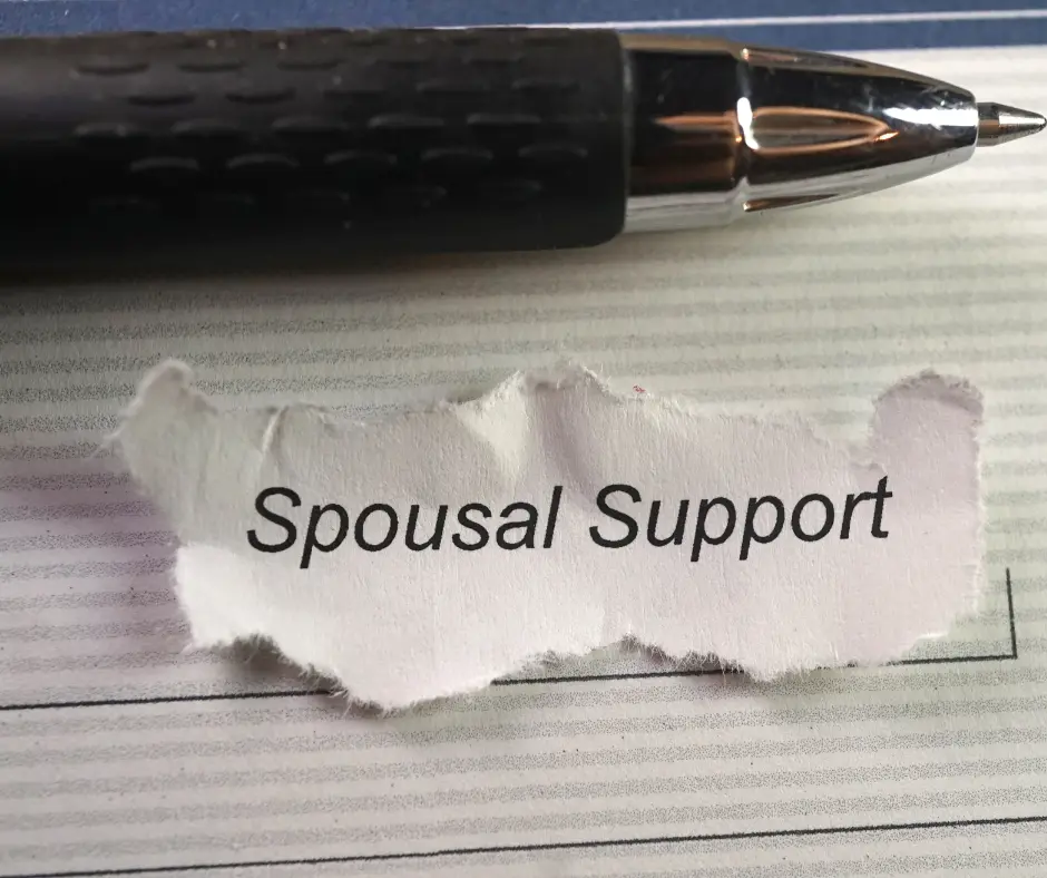 a pen and a document with a ripped paper that says "spousal support"